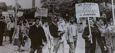 Iowans picket in front of the State Capitol to protest the use of dogs by Alabama law enforcement to break up racial civil rights protests.
