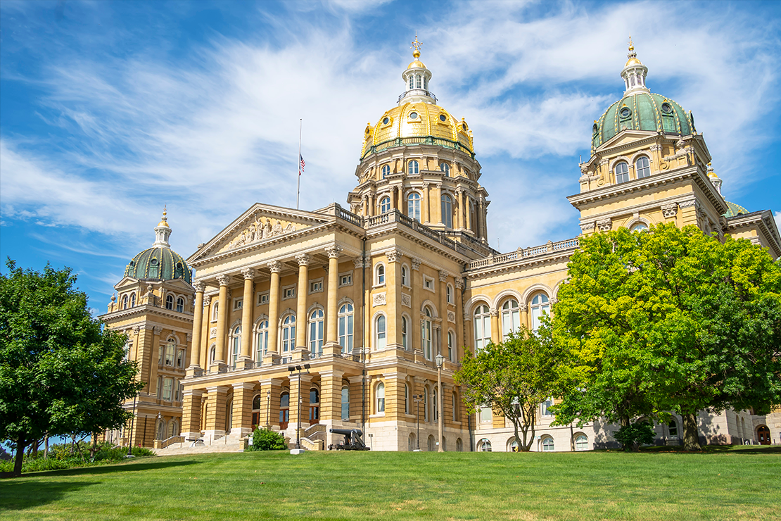 The Iowa State Capitol building on a sunny day.